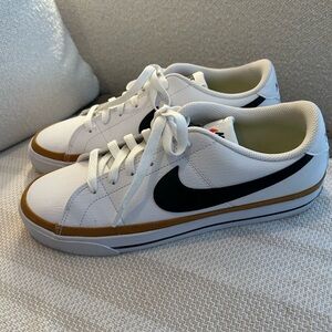 Nike White Sneakers with Black Swoosh and Brown Accent